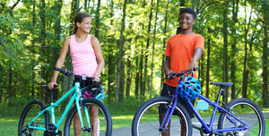 Kids smiling on a trail with their Univega Rover bicycles
