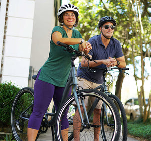 A couple biking outside with their Univega bicycles